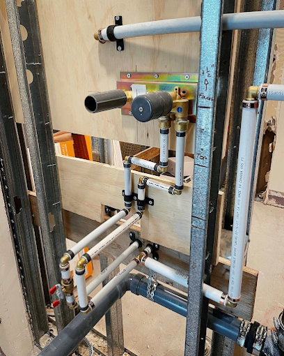 Rinnai tankless water heater rough-in installation with gas line, water supply lines, and vent connections inside framed wall – step-by-step HOW TO guide example