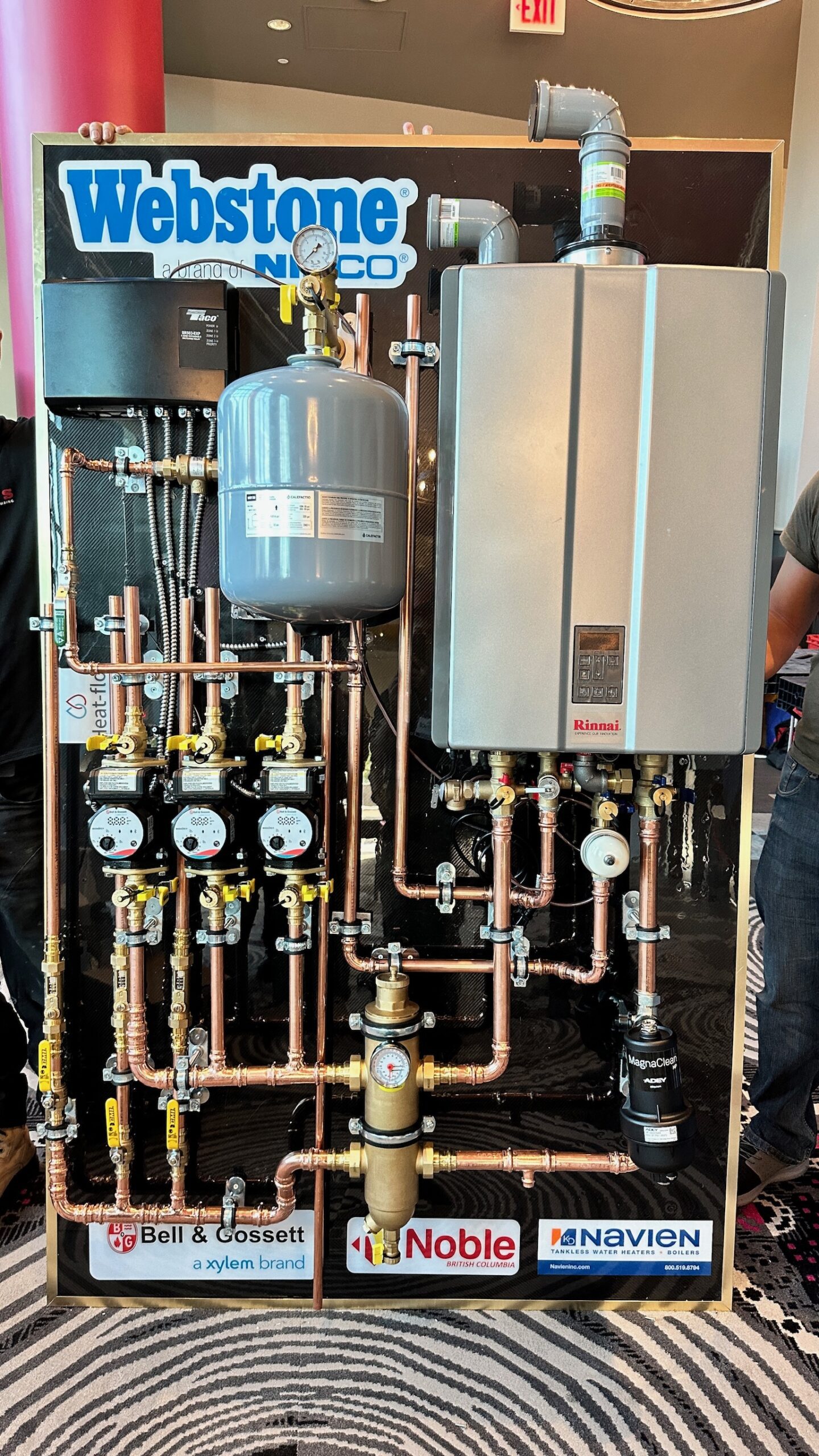 Rinnai tankless water heater installation setup with copper piping, expansion tank, gas line connections, and venting system – step-by-step HOW TO guide example